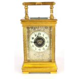 A French gilt brass repeater alarm carriage clock. H. 20cm. Understood to be in working order.