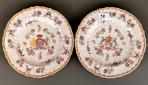 A pair of 19th Century French armorial decorated porcelain plates, Dia. 25cm.