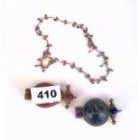 A white metal necklace and two Eastern stone set white metal prayer amulets set with hardstone,