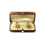 A pair of antique 14ct yellow gold (stamped 14k) gentleman's 'Love Knot' cufflinks, in original