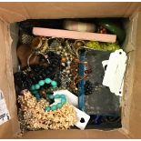 A box of mixed costume jewellery.