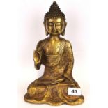A Sino-Tibetan cast bronze figure of seated Buddha wearing ornate robes decrated with Buddhist