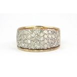 A heavy 9ct yellow and white gold diamond pave set ring, (P).