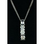 An 18ct white gold three diamond set pendant on an 18ct white gold chain, approx. 0.60ct, Pendant L.