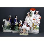 Four mid-19th Century Staffordshire figures, tallest 41cm.