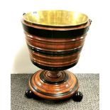 A lovely hardwood and brass ice bucket, H. 39cm.