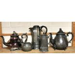 A large pewter jug and three other items.