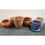 A group of six mixed terracotta plant pots, largest 35 x 35cm.