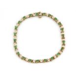 A9ct yellow gold diamond and emerald set line bracelet, L. 20cm.