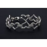 An 18ct white gold (stamped 750) diamond set heart bracelet, approx. 2.65ct, L. 20cm.