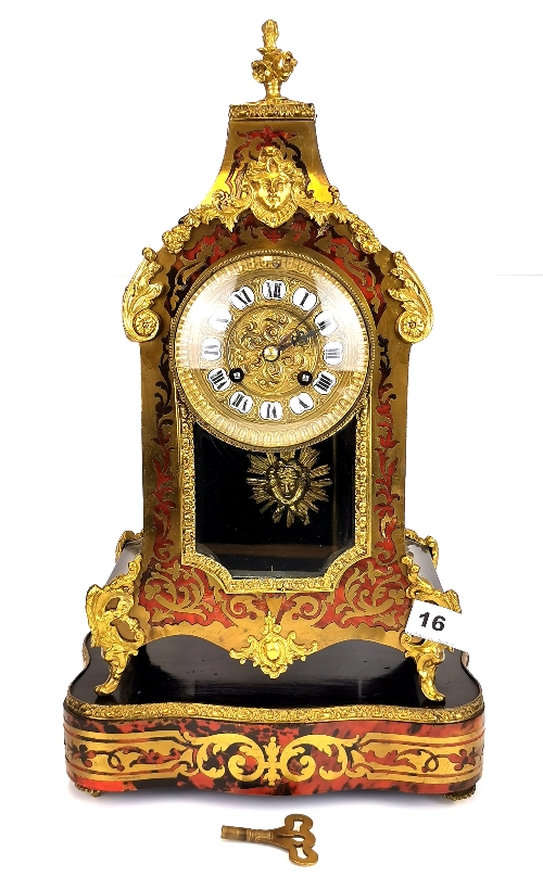 A 19th/early 20th century French Boulle decorated bracket clock and stand. H. 45cm. Understood to be