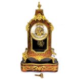 A 19th/early 20th century French Boulle decorated bracket clock and stand. H. 45cm. Understood to be