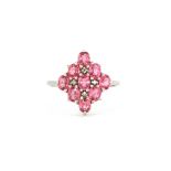 A 9ct white gold ring set with pink tourmalines and diamonds, (O).
