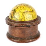 A rare 19th century wooden cased desktop globe Dia. 9.50cm. Notation to base 1858.