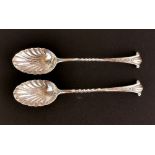 A pair of hallmarked silver shell bowl coffee spoons by Henry Atkins (Sheffield 1909).