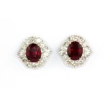 A pair of 18ct white gold (stamped 750) ruby and diamond set cluster earrings, diamond approx. 1.