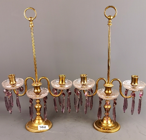 A pair of gilt brass and crystal drop candelabra, H. 44cm.