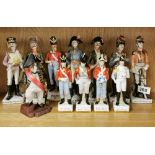 A group of porcelain figures of soldiers and a bulldog Nelson figure.