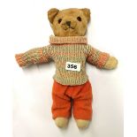 A lovely vintage articulated plush teddy bear with glass eyes looking for a new home, H. 32cm.
