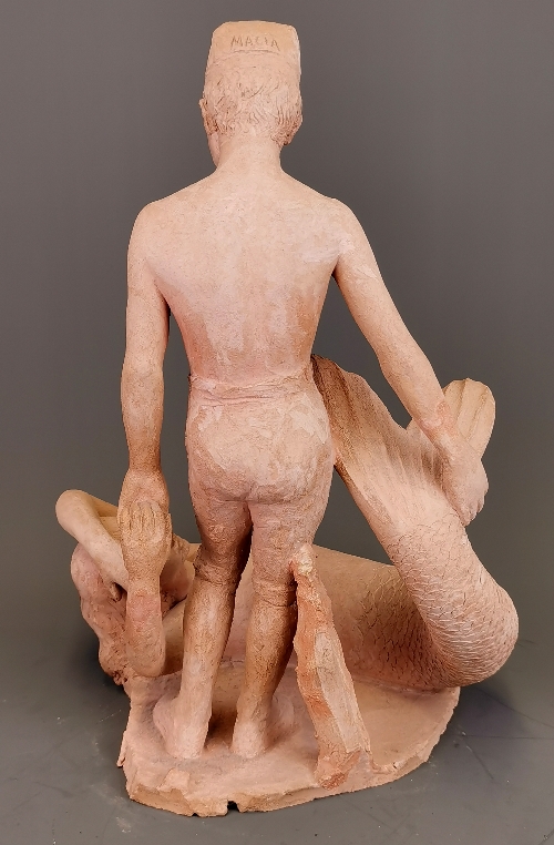 An interesting hand made pottery figure of a boy with a mermaid. H. 35cm. - Image 2 of 3