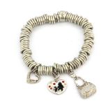 A 925 silver Links of London charm bracelet with three charms.