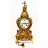 A early 20th Century ormolu mounted clock by AD Mougin, Paris, with marquetry case. H. 36cm.