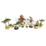 A set of Japanese porcelain miniature garden figures, tallest 10cm.