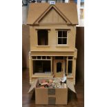 A hand made, partially complete, shop dolls house, H. 77cm, with shop keeper and flower shop