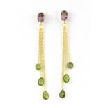 A pair of 925 silver drop earrings set with faceted cut peridots and oval cut amethysts, L. 7.1cm.