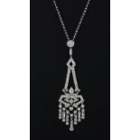 An Art Deco style 18ct white gold diamond set pendant and chain, approx. 1.90ct, pendant L. 7cms