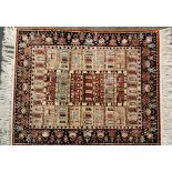 A very fine quality Persian carved silk rug, W. 87cm, L. 108cm.