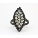 A 925 silver moonstone and black spinel ring, (O).