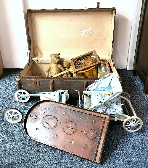 A vintage cabin trunk containing four articulated teddy bears, a vintage movie projector, Flashy