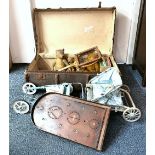 A vintage cabin trunk containing four articulated teddy bears, a vintage movie projector, Flashy