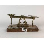 A brass Post Office balance scale, L. 25cm, (missing the smallest weight).