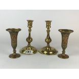 A pair of 19th Century brass candlesticks, H. 17cm, and a pair of Indian brass vases.