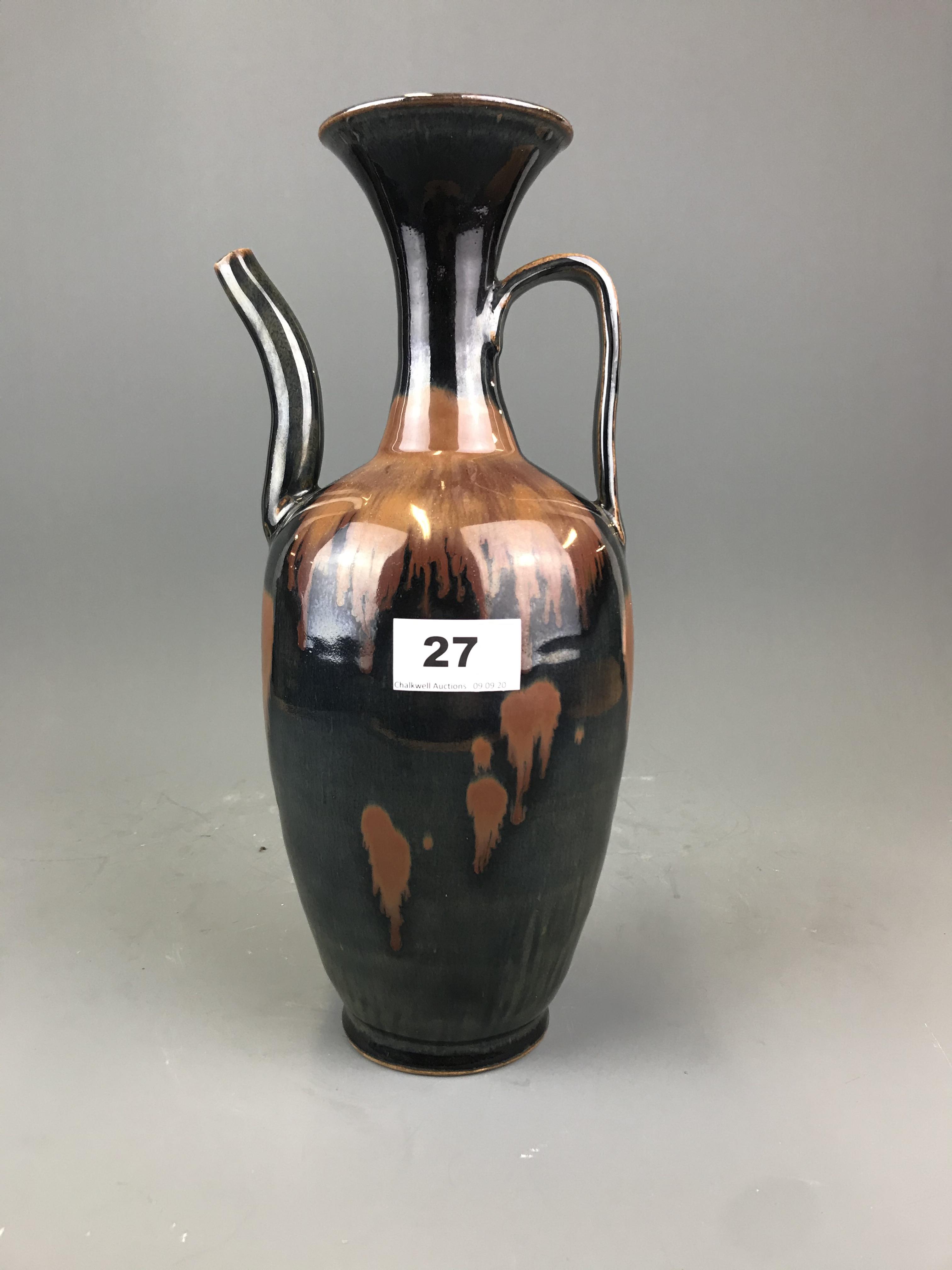 A Chinese brown and black glazed stoneware ewer, possibly Song Dynasty, H. 31cm. Condition: old