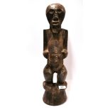 An African tribal carved wooden figure, H. 53cm.