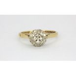 An 18ct yellow gold diamond cluster ring, (O).
