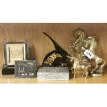 A vintage chrome desk calendar, a letter stamp and other items.