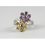 A 925 silver daisy crossover ring set with citrine, amethyst and diamond.