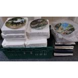 A large quantity of boxed and unboxed collectors plates.