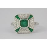 A lovely 18ct (stamped 18k) white gold Art Deco style ring set with emeralds and diamonds (N.5)