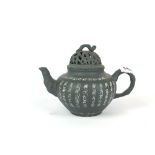 A Chinese green stained Yixing terracotta teapot with pierced lid and incised and white
