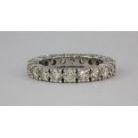 A superb white metal (tested minimum 18ct white gold) full eternity ring set with over 3ct