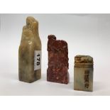 A group of Chinese carved soapstone seals, tallest 13.5cm.