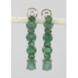 A pair of 925 silver earrings set with oval cut emeralds, L. 32cm.