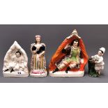 Four mid 19th Century Staffordshire figures of theatrical characters, tallest 22cm.