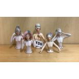 Five porcelain half dolls, tallest 9cm.