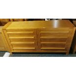 A contemporary solid oak eight drawer chest, W. 170cm, H. 88cm.